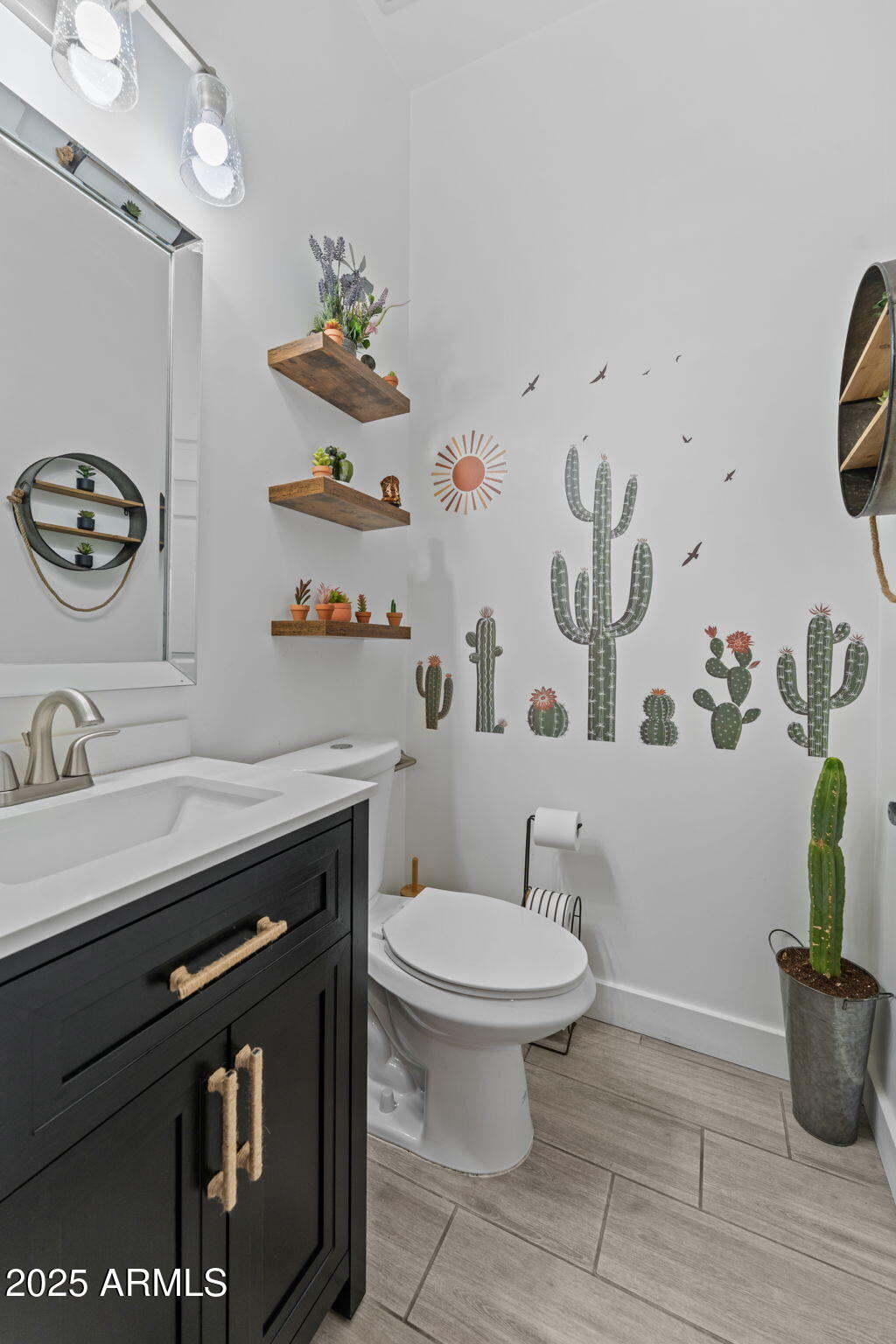 10534 East Butte Street Apache Junction, AZ 85120 - Photo 37 of 51 a bathroom with a sink a toilet and a mirror