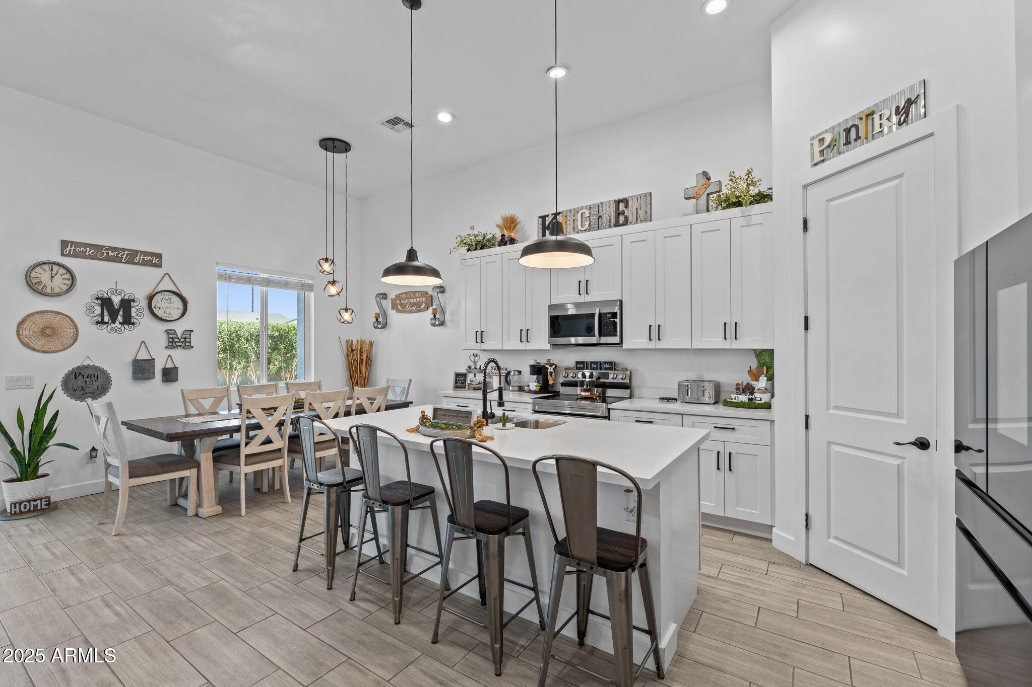 10534 East Butte Street Apache Junction, AZ 85120 - Photo 8 of 51 a kitchen with appliances a table and chairs in it