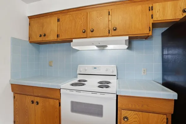 a kitchen with a stove and a microwave