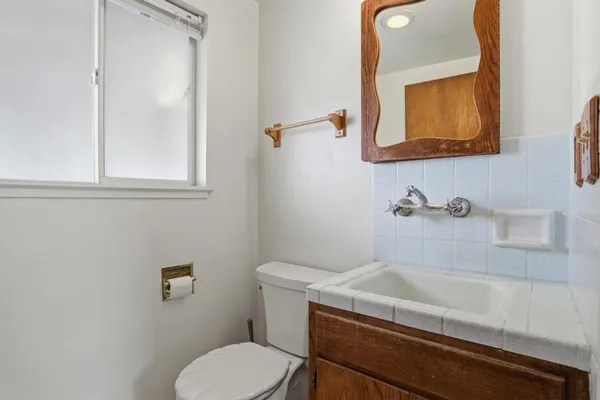 a bathroom with a sink and a toilet