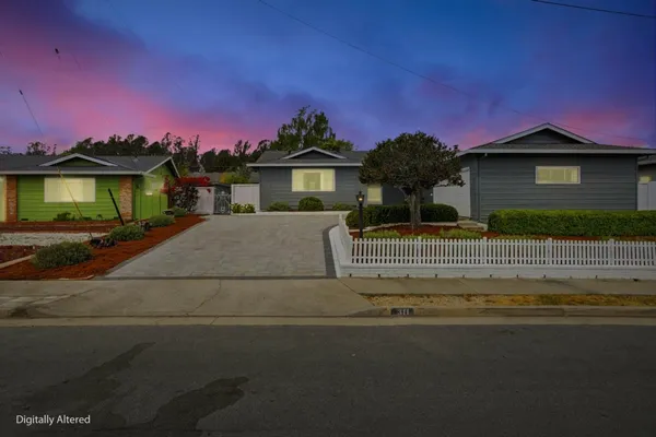 a swimming pool with barbeque oven and outdoor seating