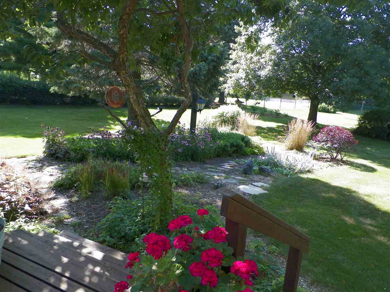 2995 East Water Road Byron, IL 61010 - Photo 24 of 25 a view of a flower in a yard