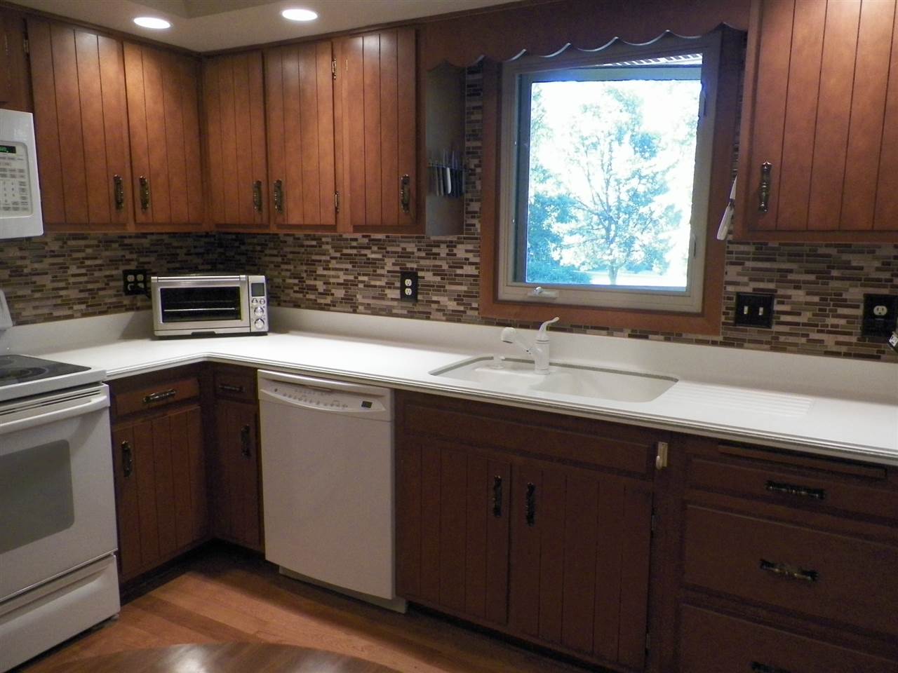 2995 East Water Road Byron, IL 61010 - Photo 4 of 25 a kitchen with a sink cabinets and window