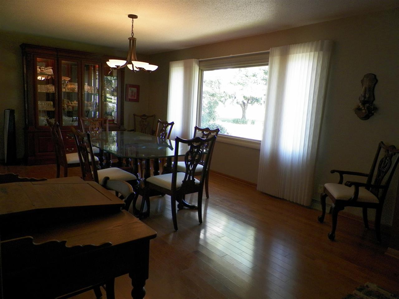 2995 East Water Road Byron, IL 61010 - Photo 6 of 25 a view of a dining room with furniture window and wooden floor