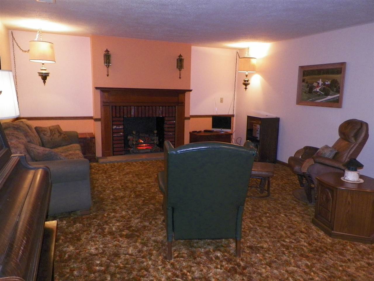 2995 East Water Road Byron, IL 61010 - Photo 7 of 25 a living room with furniture and a fireplace