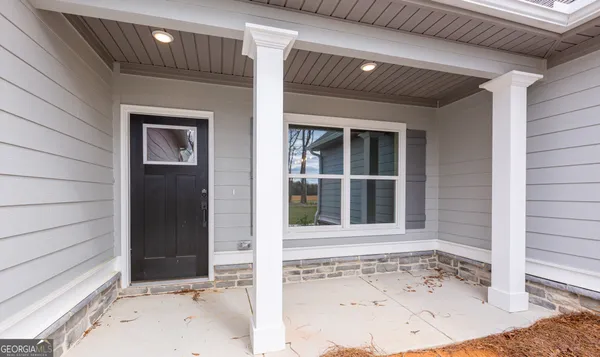 a view of a door and a window