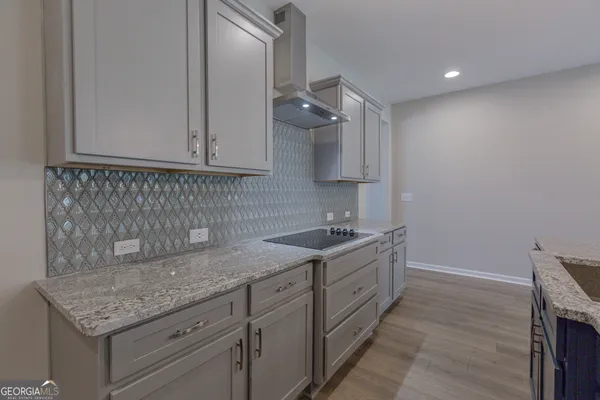a kitchen with a sink and cabinets