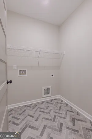 a view of a livingroom with a ceiling fan and window