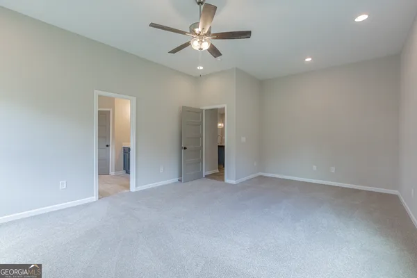 a bathroom with double vanity sinks and a mirror