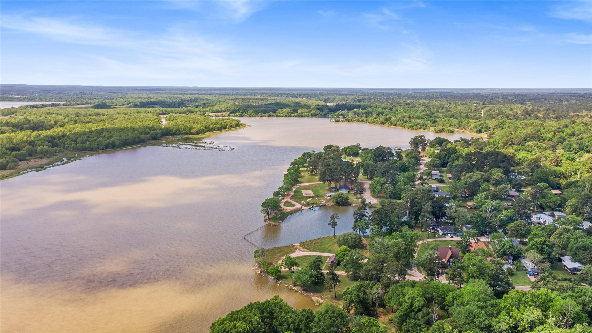 Tbd Sportsman Drive Trinity, TX 75862 - Photo 12 of 19 an aerial view of a city with lots of residential buildings and ocean in the back