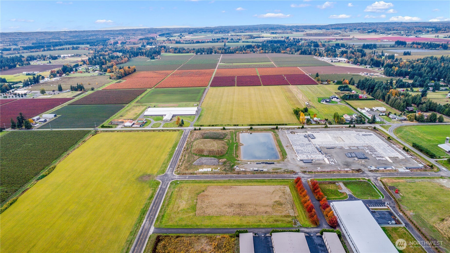 602 Redwood Road Lynden, WA 98264 - Photo 14 of 22 an aerial view of a tennis ground and a cars park
