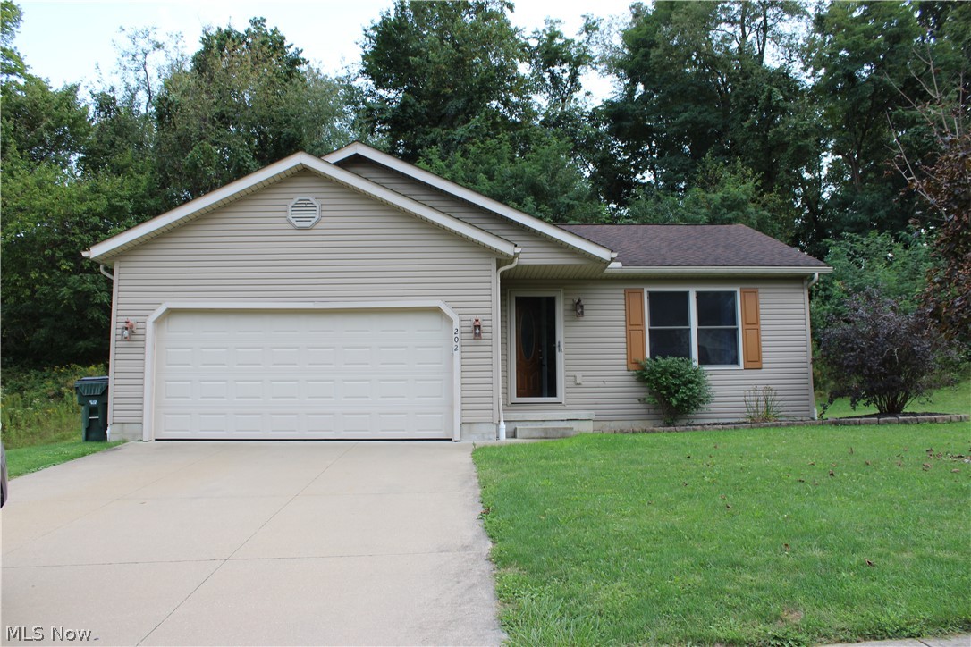 202 Home Street Rittman, OH 44270 - Photo 23 of 47 Single-story residence featuring light-colored siding and a two-car garage