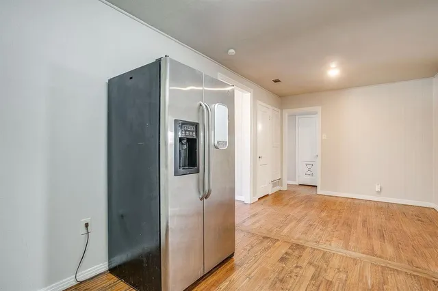 a view of hallway with a bathroom
