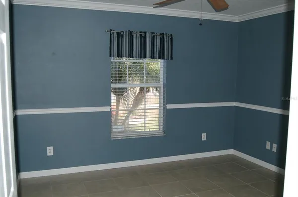 a view of an empty room with windows