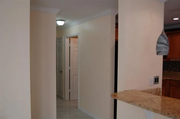 a view of a kitchen from the hallway