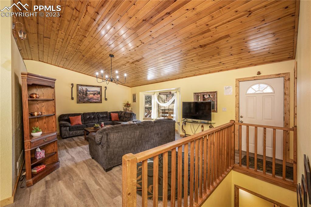 1313 Spring Valley Drive Divide, CO 80814 - Photo 2 of 25 a living room with furniture and a flat screen tv