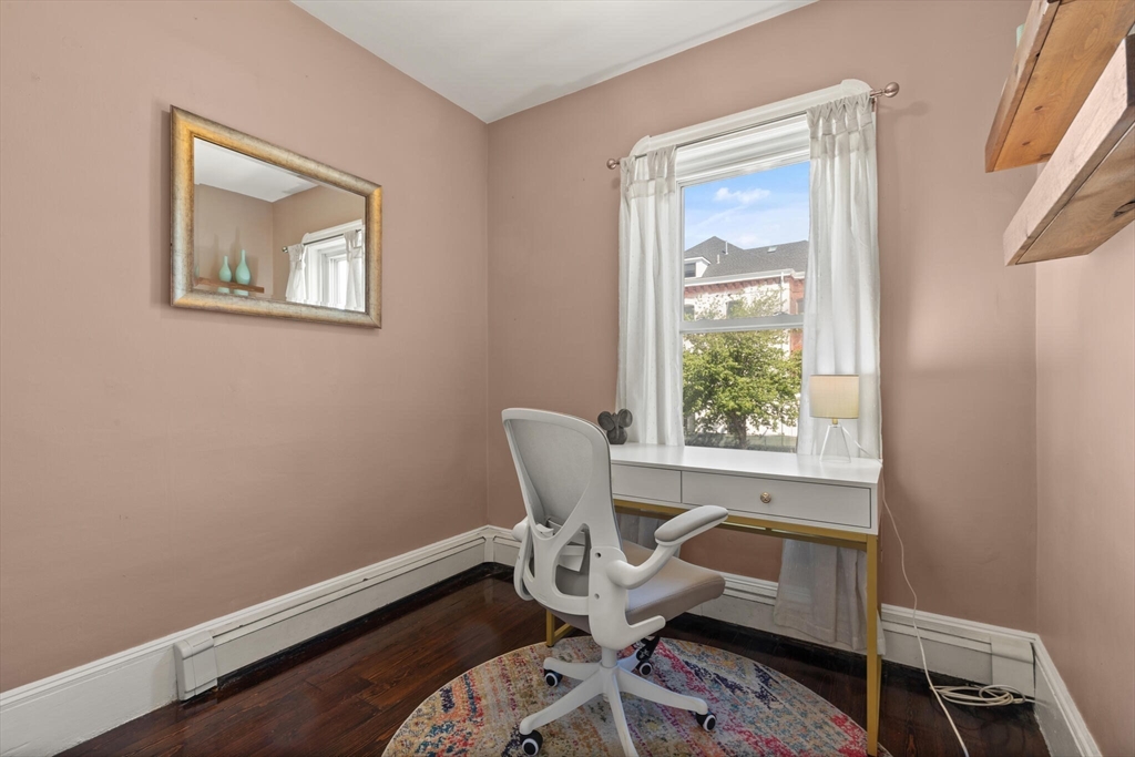 573 Bennington Street, Unit 2 Boston, MA 02128 - Photo 14 of 22 a workspace with wooden floor and a window