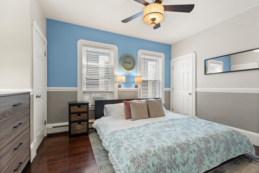 573 Bennington Street, Unit 2 Boston, MA 02128 - Photo 16 of 22 a bedroom with a bed and a window