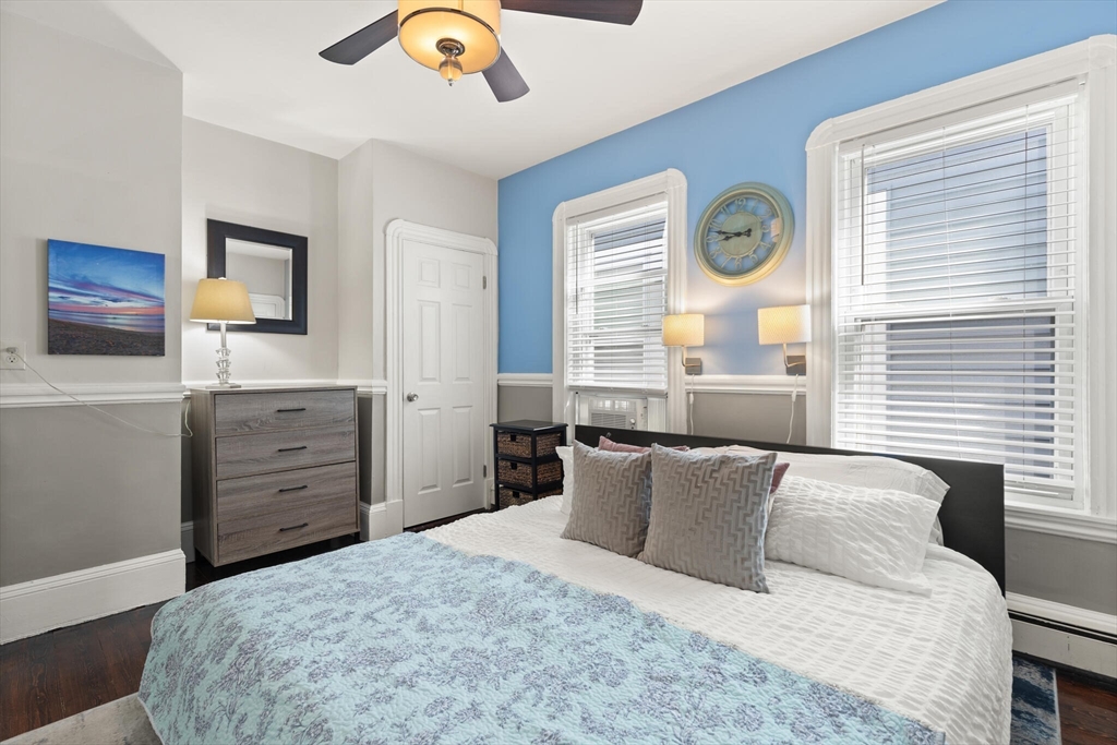 573 Bennington Street, Unit 2 Boston, MA 02128 - Photo 17 of 22 a bedroom with a bed and a dresser