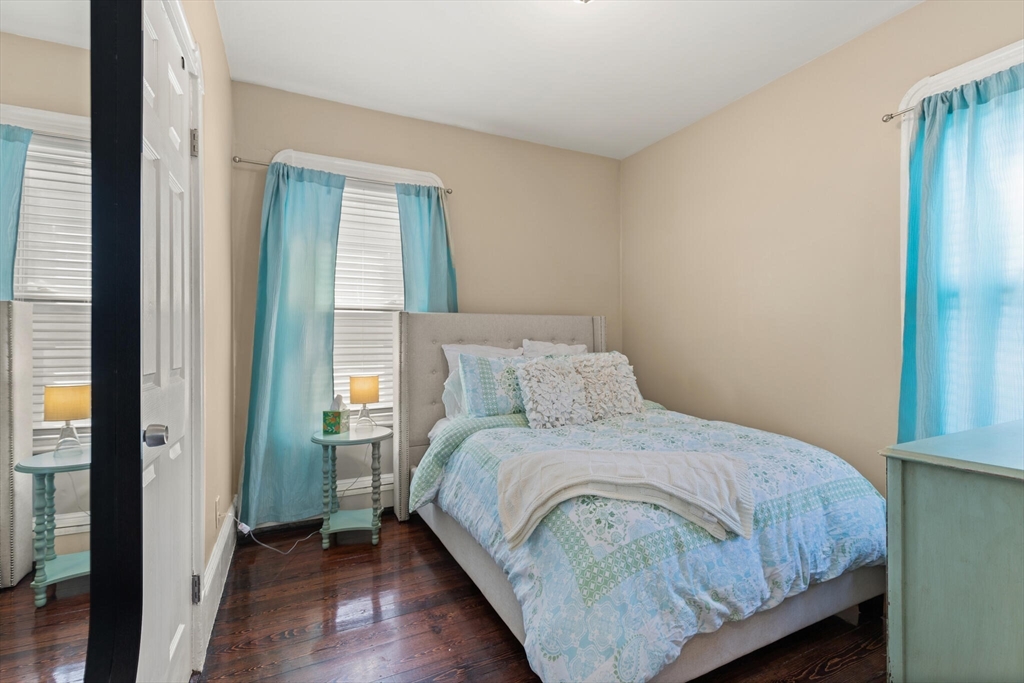 573 Bennington Street, Unit 2 Boston, MA 02128 - Photo 18 of 22 a bedroom with a bed and a window