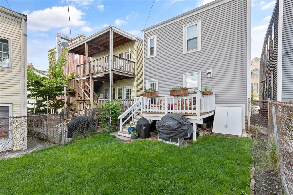 573 Bennington Street, Unit 2 Boston, MA 02128 - Photo 21 of 22 a front view of a house with garden