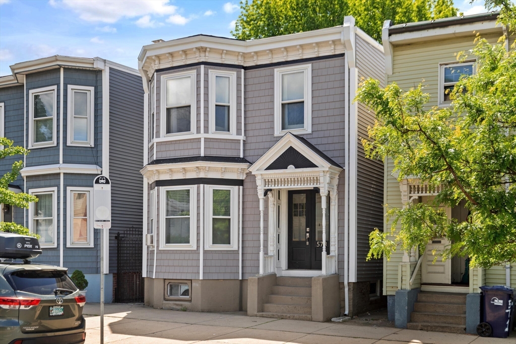 573 Bennington Street, Unit 2 Boston, MA 02128 - Photo 22 of 22 a front view of a house with a yard