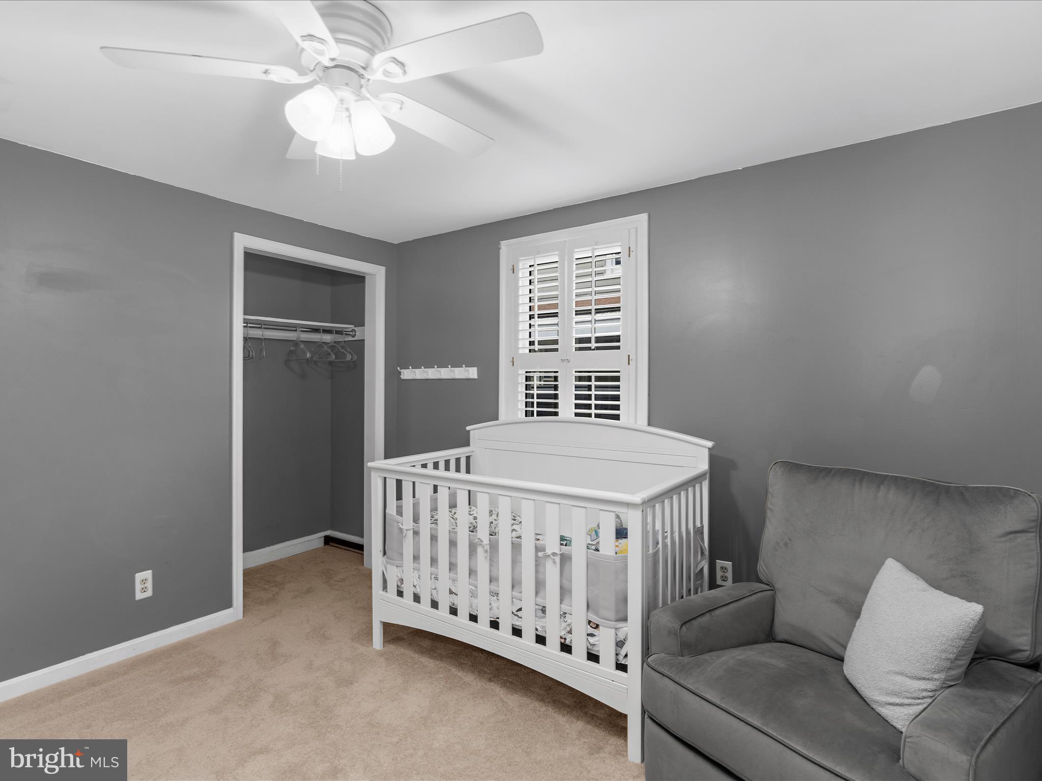 5521 Patrick Henry Drive Baltimore, MD 21225 - Photo 11 of 33 a bedroom with a bed and a chandelier