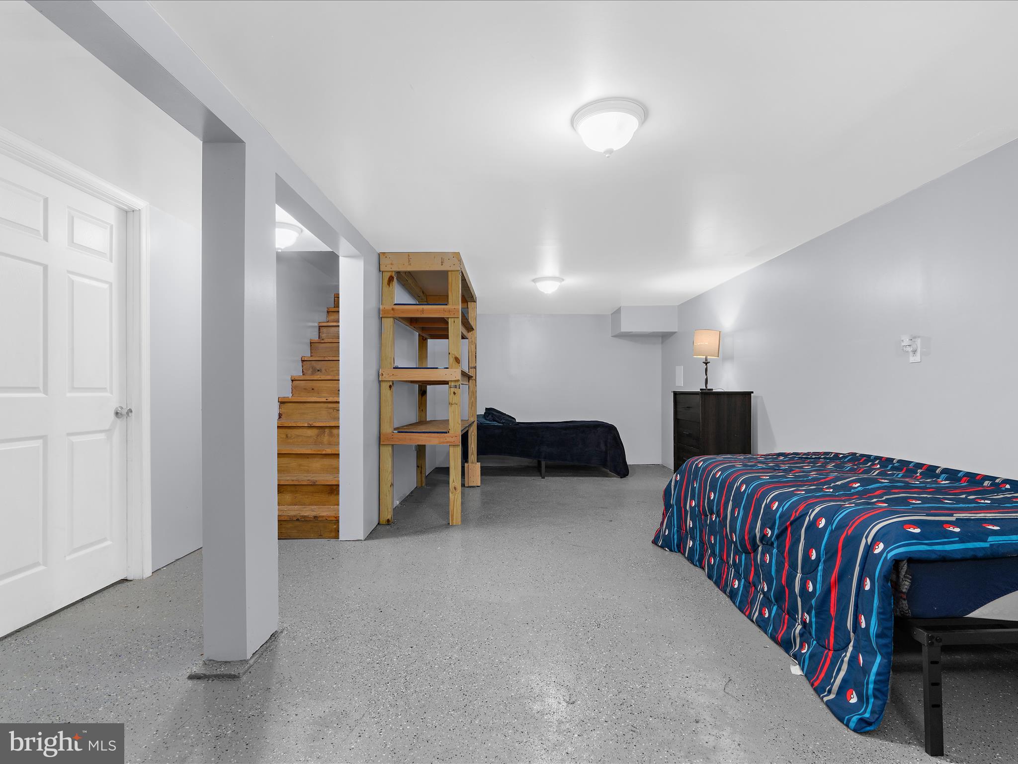 5521 Patrick Henry Drive Baltimore, MD 21225 - Photo 16 of 33 a bedroom with a bed and a walk in closet