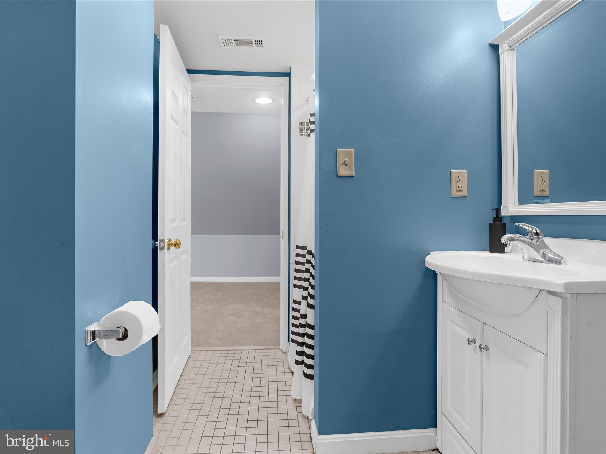 5521 Patrick Henry Drive Baltimore, MD 21225 - Photo 24 of 33 a bathroom with a sink a toilet and shower