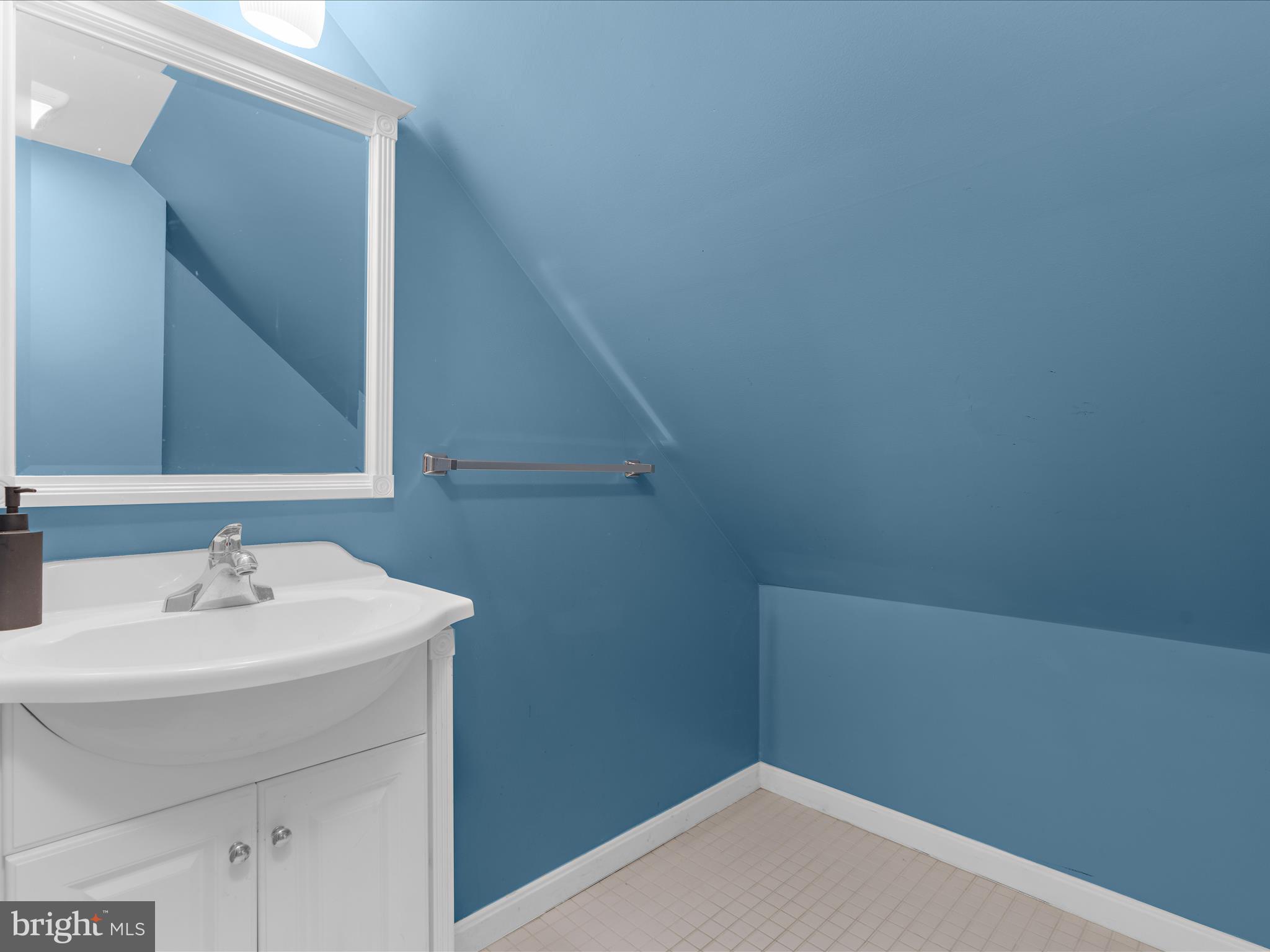 5521 Patrick Henry Drive Baltimore, MD 21225 - Photo 25 of 33 a bathroom with a sink and a mirror