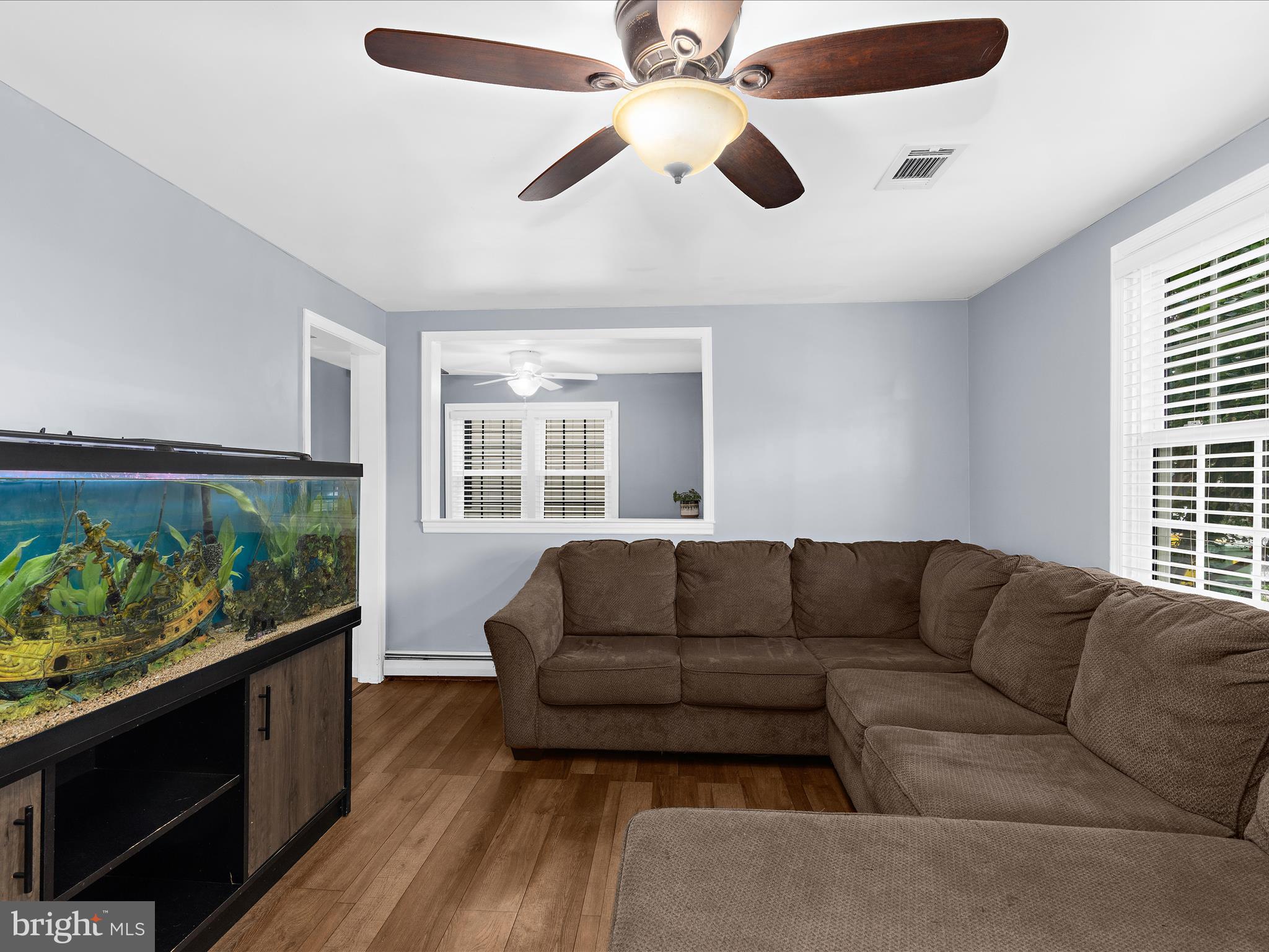 5521 Patrick Henry Drive Baltimore, MD 21225 - Photo 4 of 33 a living room with furniture and a flat screen tv