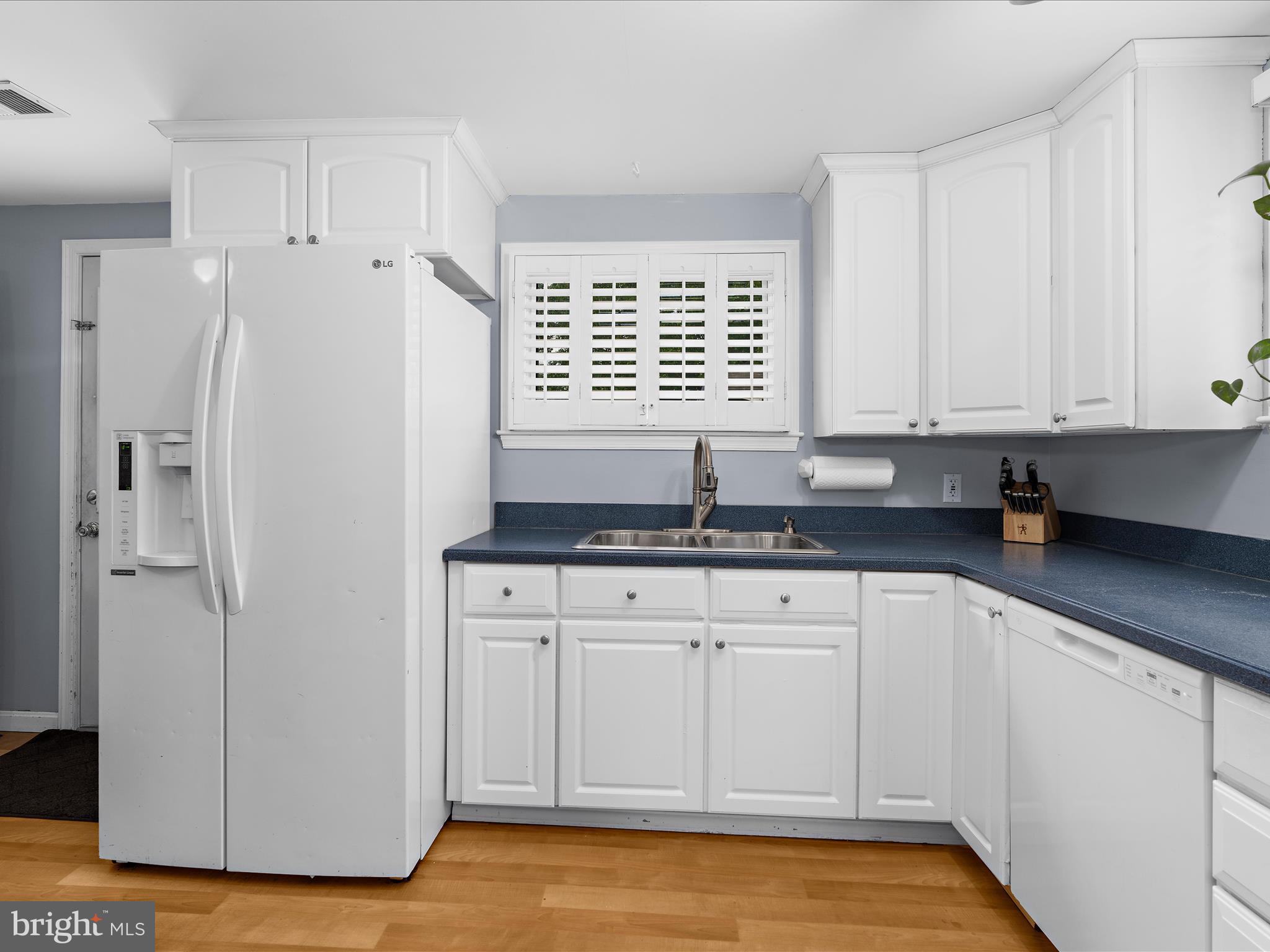 5521 Patrick Henry Drive Baltimore, MD 21225 - Photo 6 of 33 a kitchen with stainless steel appliances granite countertop a refrigerator sink and cabinets