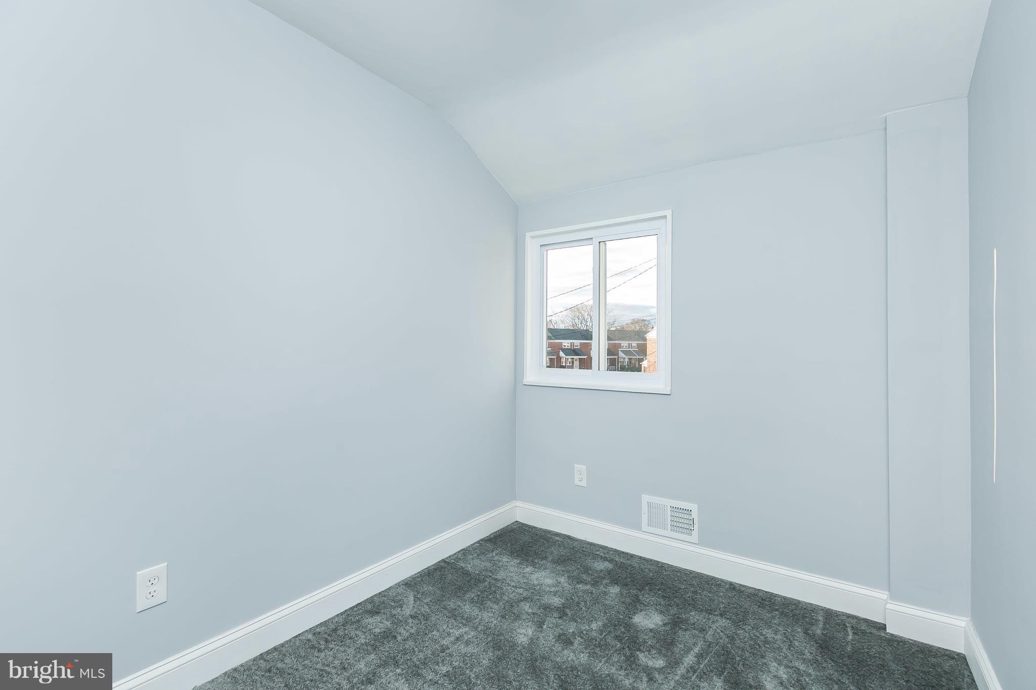 7808 Charlesmont Road Baltimore, MD 21222 - Photo 20 of 32 an empty room with windows