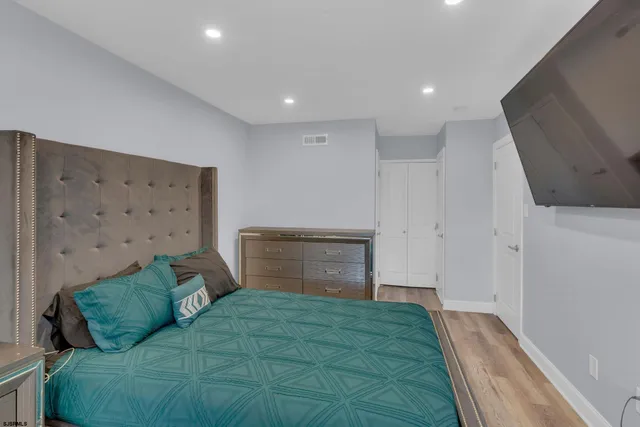 a bed room with a bed and a couch