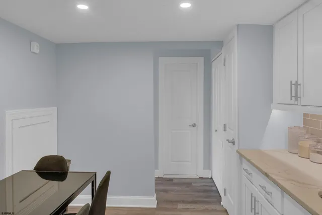 a hallway with a wooden floor