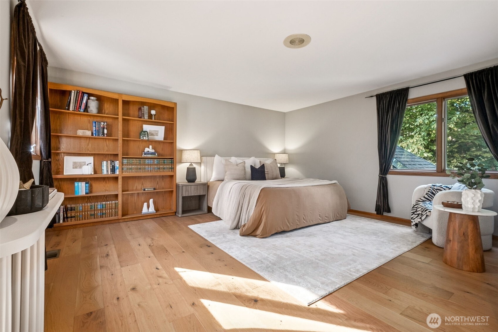 21720 Southeast 246th Street Maple Valley, WA 98038 - Photo 21 of 38 a bedroom with a large bed and a large window
