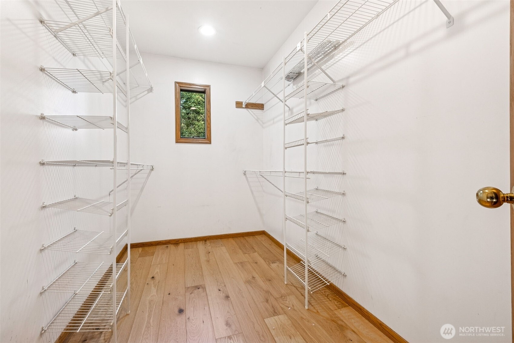 21720 Southeast 246th Street Maple Valley, WA 98038 - Photo 24 of 38 a view of walk in closet with empty racks