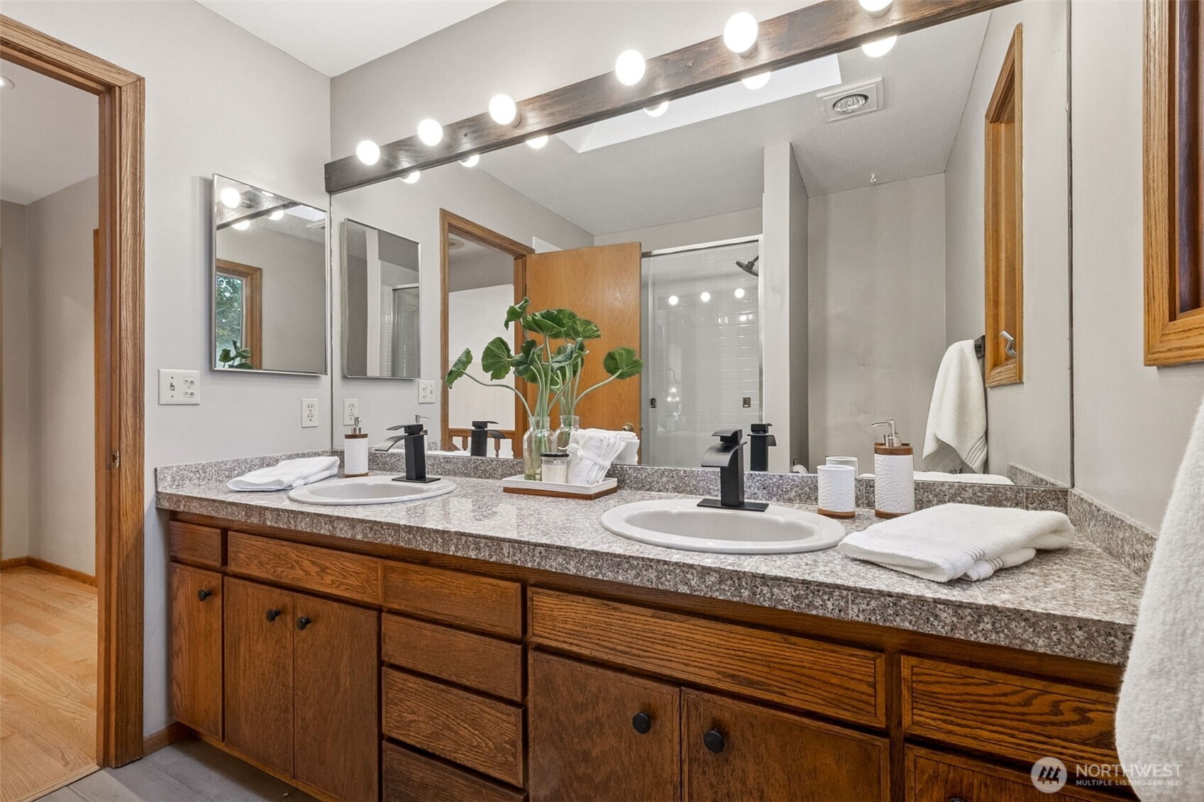 21720 Southeast 246th Street Maple Valley, WA 98038 - Photo 25 of 38 a bathroom with a granite countertop double vanity sink and a mirror