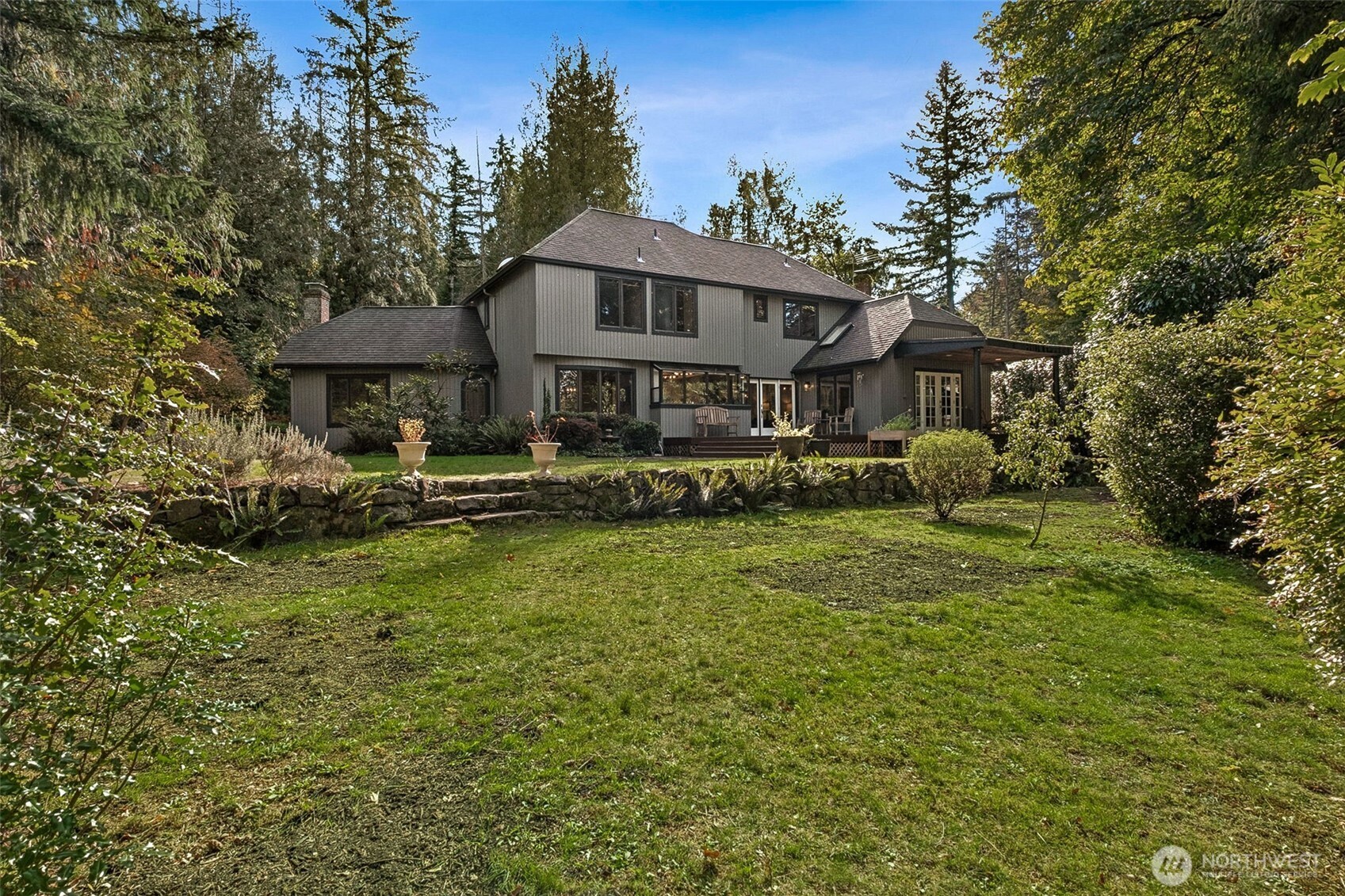 21720 Southeast 246th Street Maple Valley, WA 98038 - Photo 29 of 38 a front view of a house with a yard table and chairs