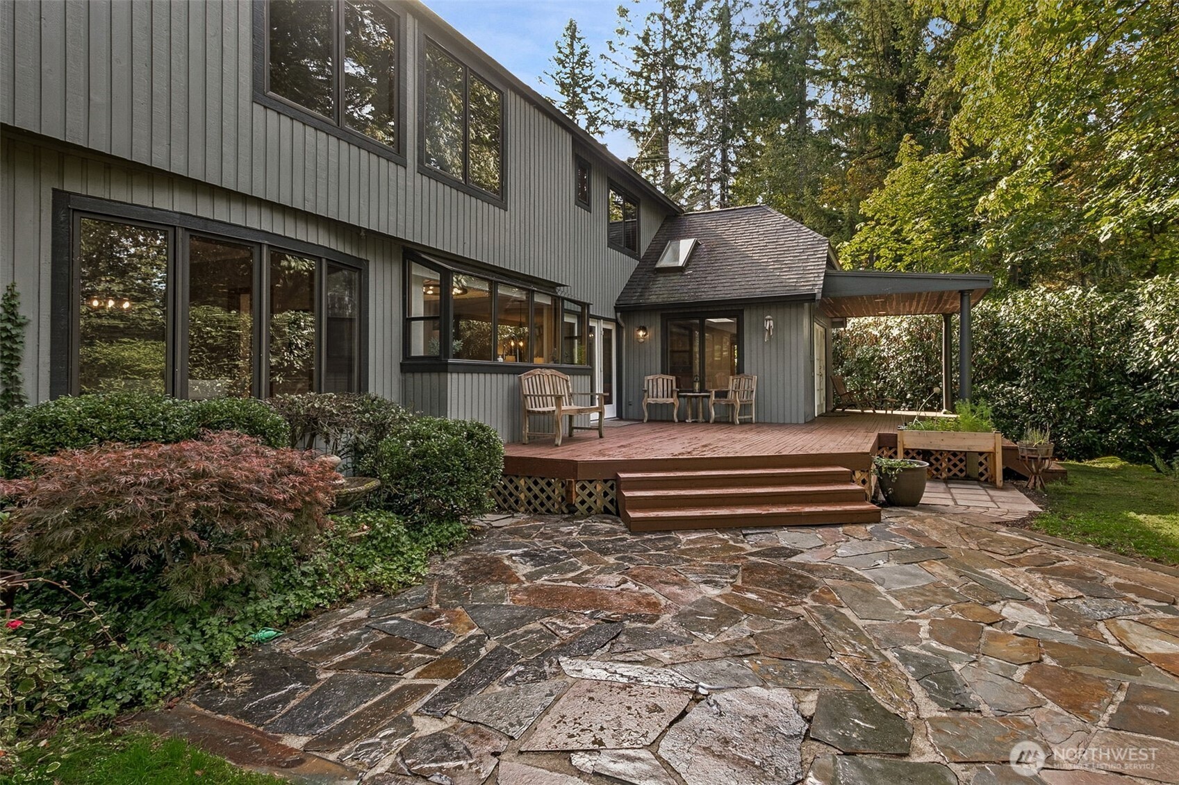 21720 Southeast 246th Street Maple Valley, WA 98038 - Photo 31 of 38 a front view of a building with garden