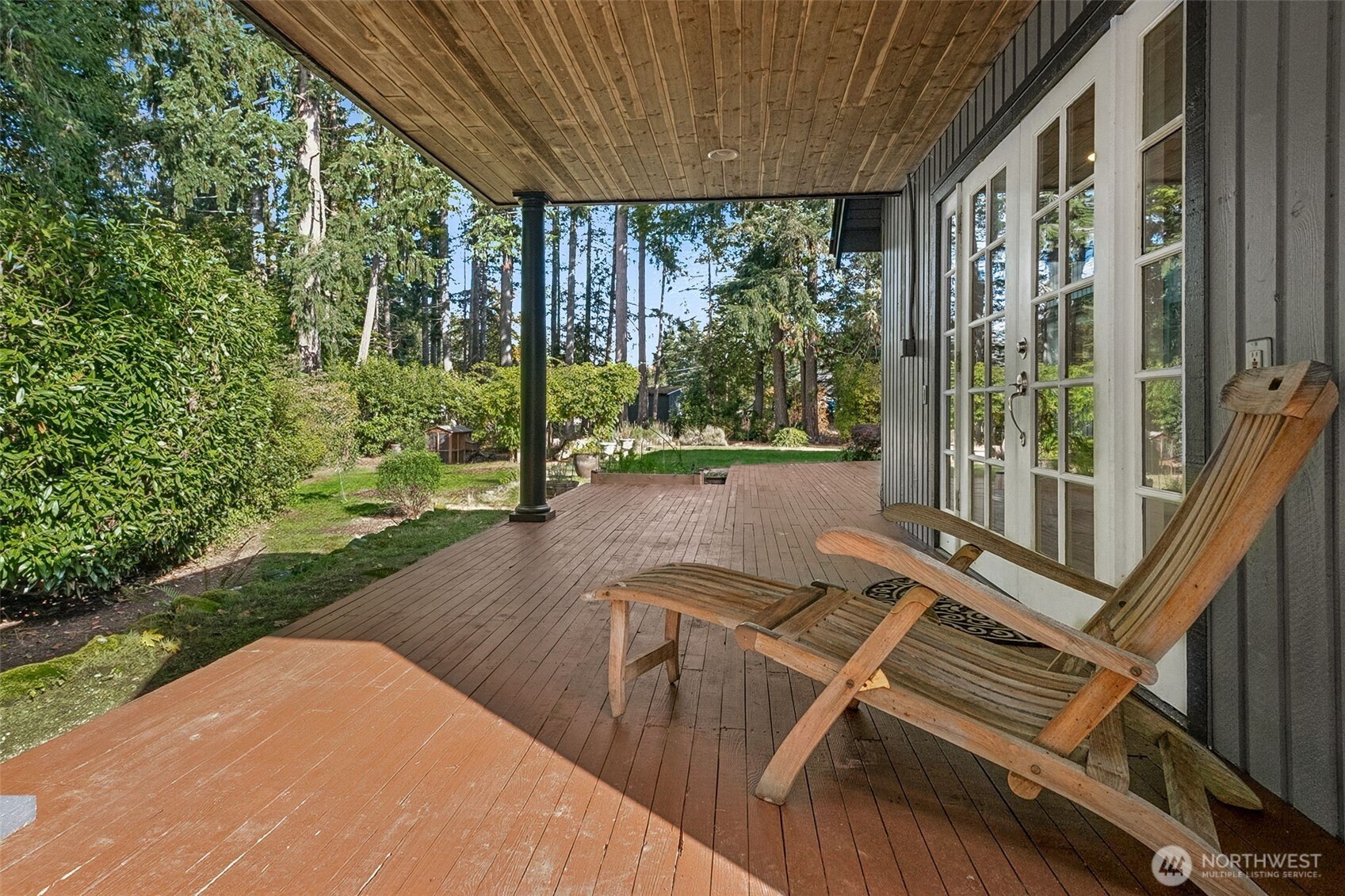 21720 Southeast 246th Street Maple Valley, WA 98038 - Photo 32 of 38 a view of a balcony with floor to ceiling windows and yard