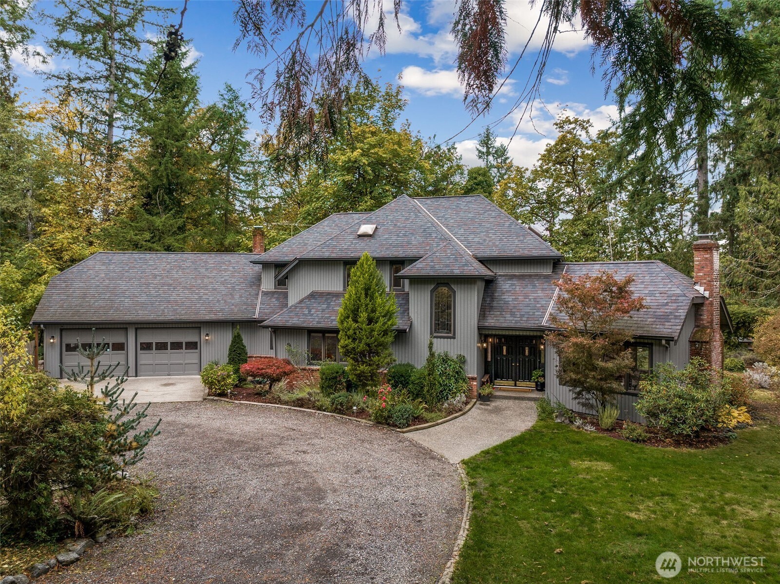 21720 Southeast 246th Street Maple Valley, WA 98038 - Photo 38 of 38 a front view of a house with garden