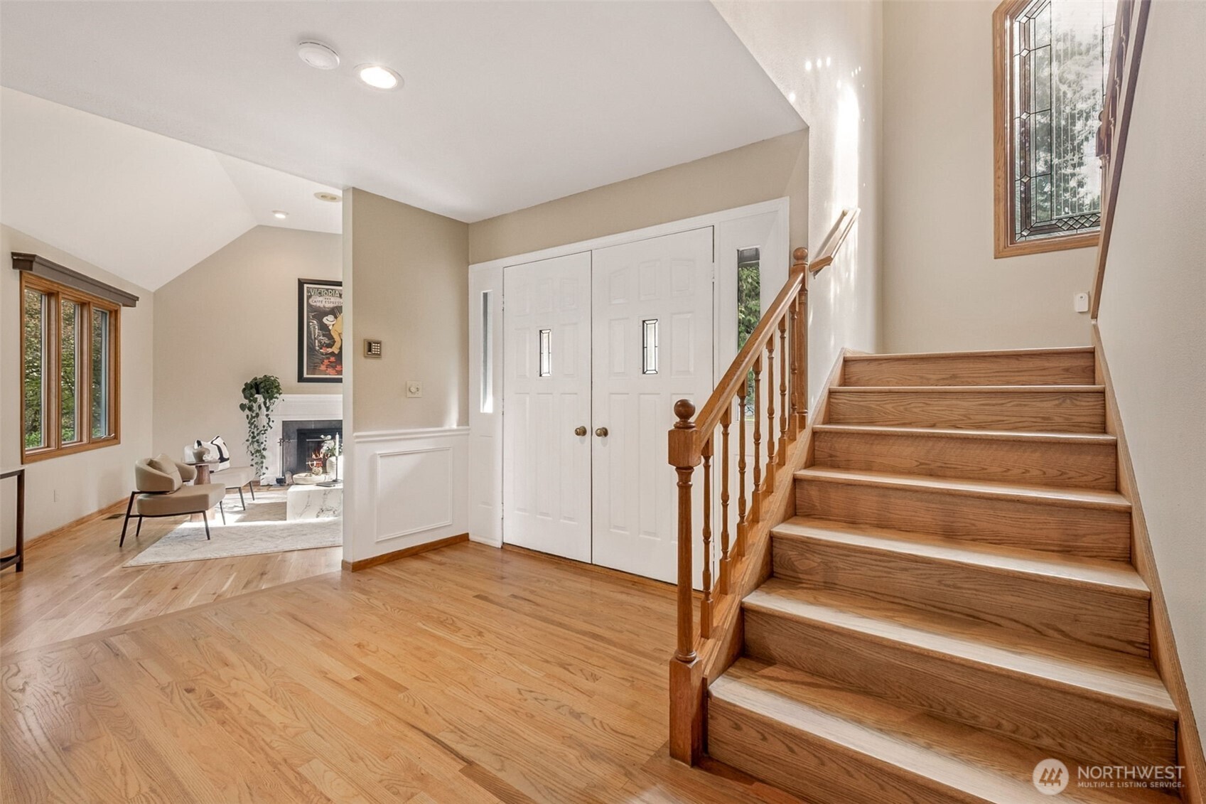 21720 Southeast 246th Street Maple Valley, WA 98038 - Photo 4 of 38 a view of entryway and hall with wooden floor