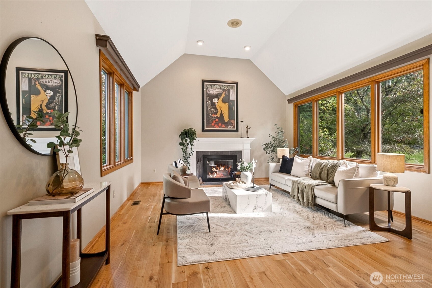 21720 Southeast 246th Street Maple Valley, WA 98038 - Photo 5 of 38 a living room with furniture a fireplace and a large window