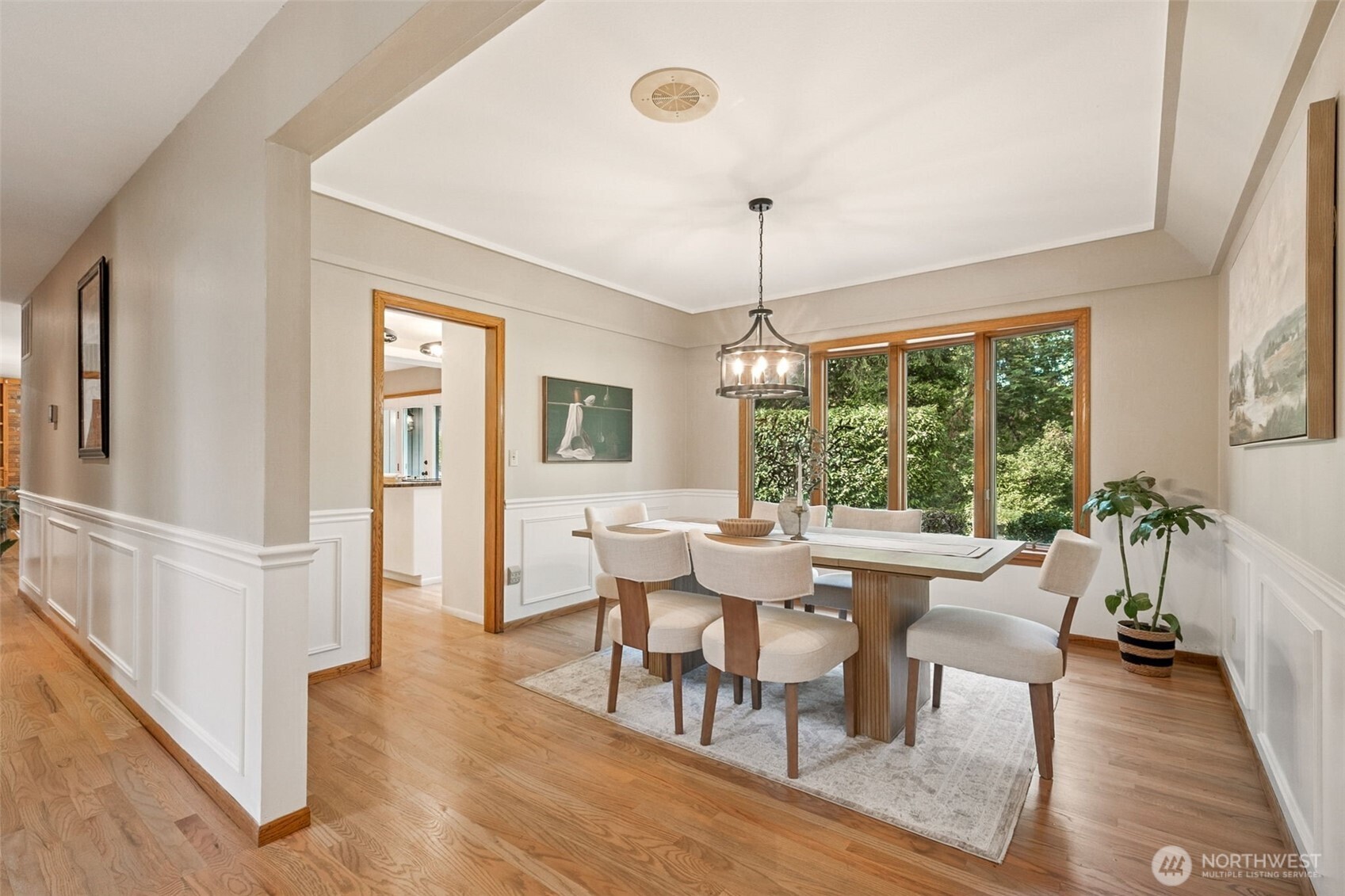 21720 Southeast 246th Street Maple Valley, WA 98038 - Photo 7 of 38 a view of a dining room with furniture window and wooden floor