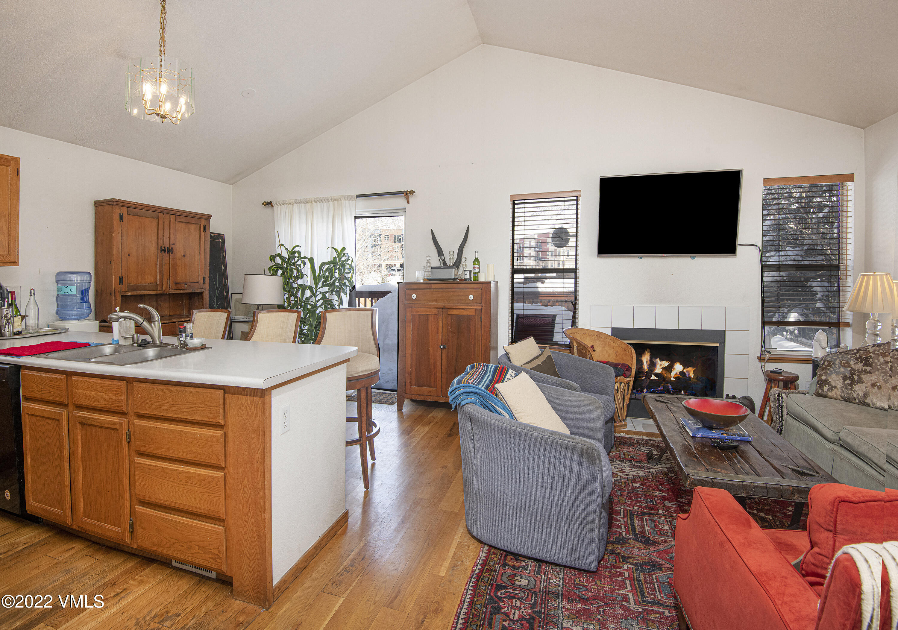 5175 Eaglebend Drive Avon, CO 81620 - Photo 4 of 23 a living room with furniture a flat screen tv and a fireplace