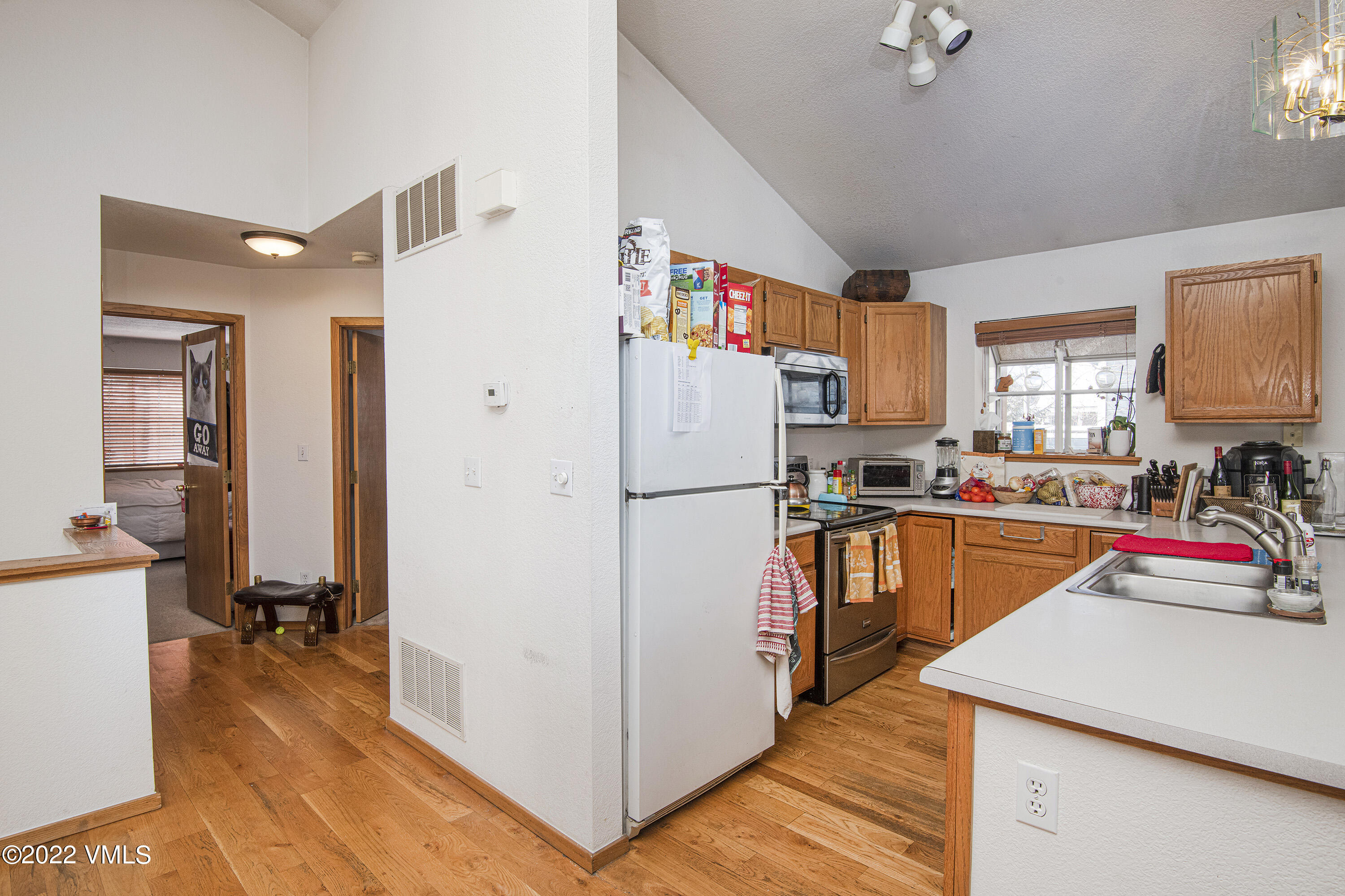 5175 Eaglebend Drive Avon, CO 81620 - Photo 8 of 23 a kitchen with stainless steel appliances granite countertop a refrigerator a stove and a sink with cabinets