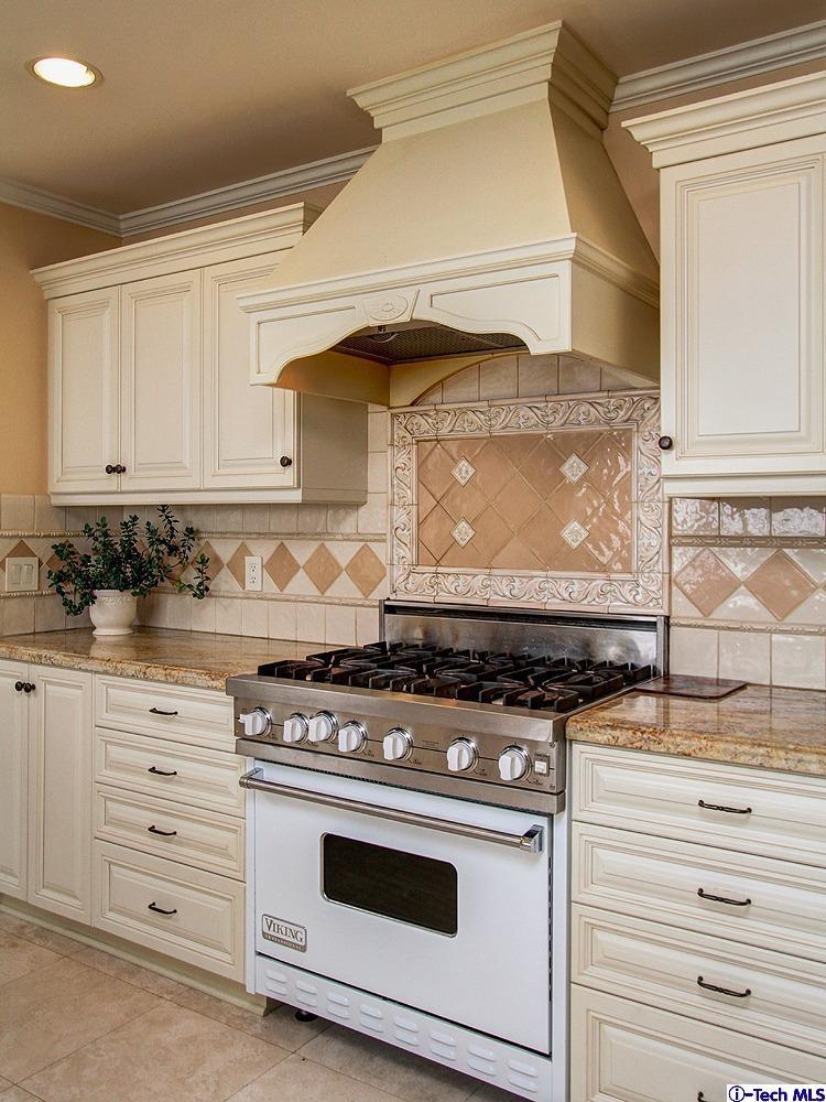 931 Roxbury Road San Marino, CA 91108 - Photo 15 of 37 a stove top oven sitting inside of a kitchen