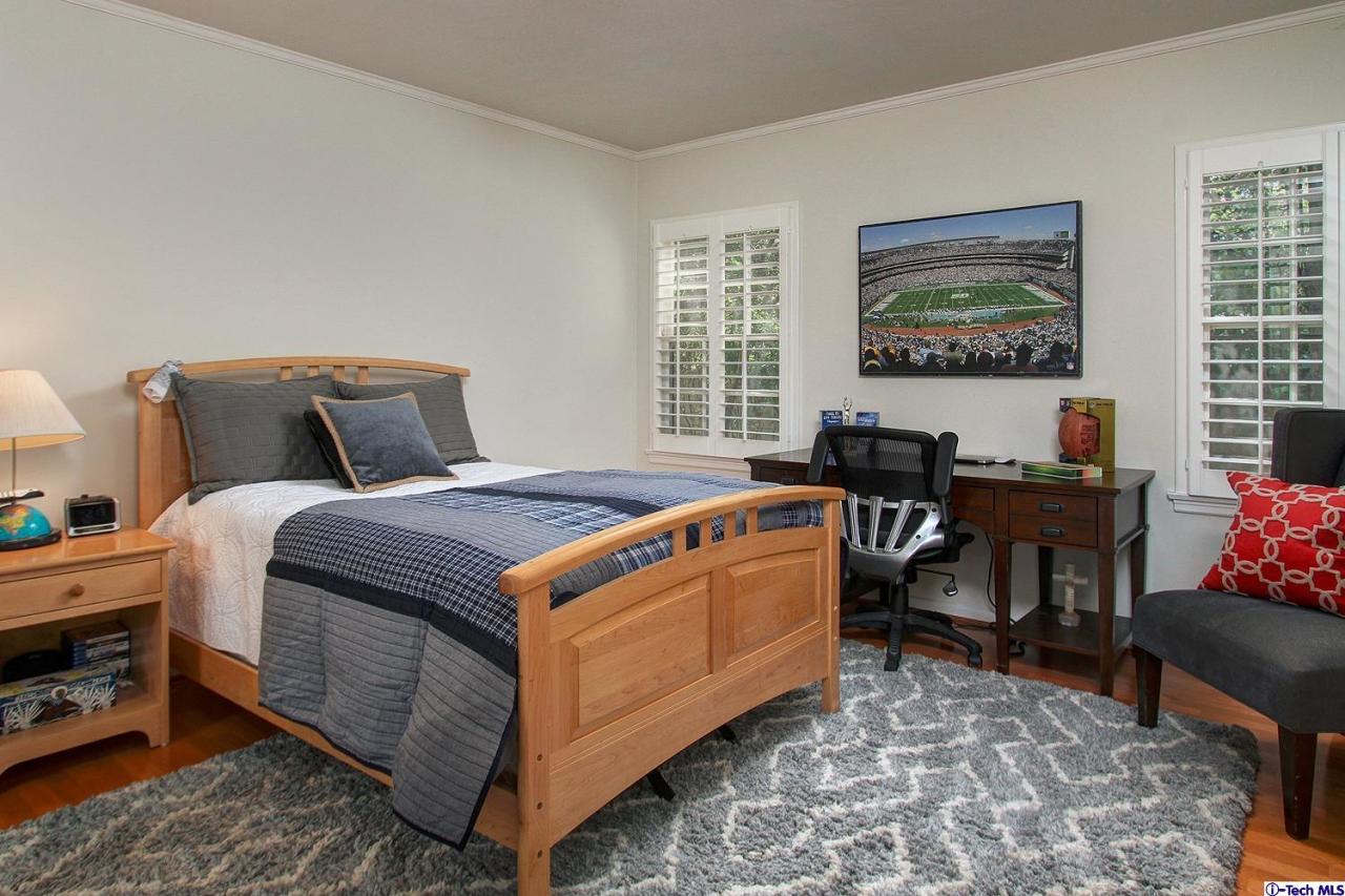 931 Roxbury Road San Marino, CA 91108 - Photo 24 of 37 a bed room with a bed and a chair