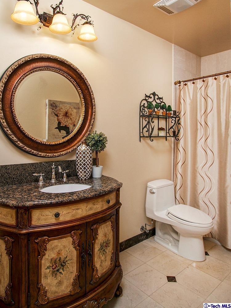 931 Roxbury Road San Marino, CA 91108 - Photo 25 of 37 a bathroom with a toilet and a sink